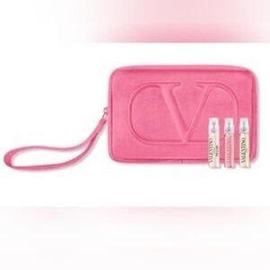 Valentino wristlet with 3 travel perfumes